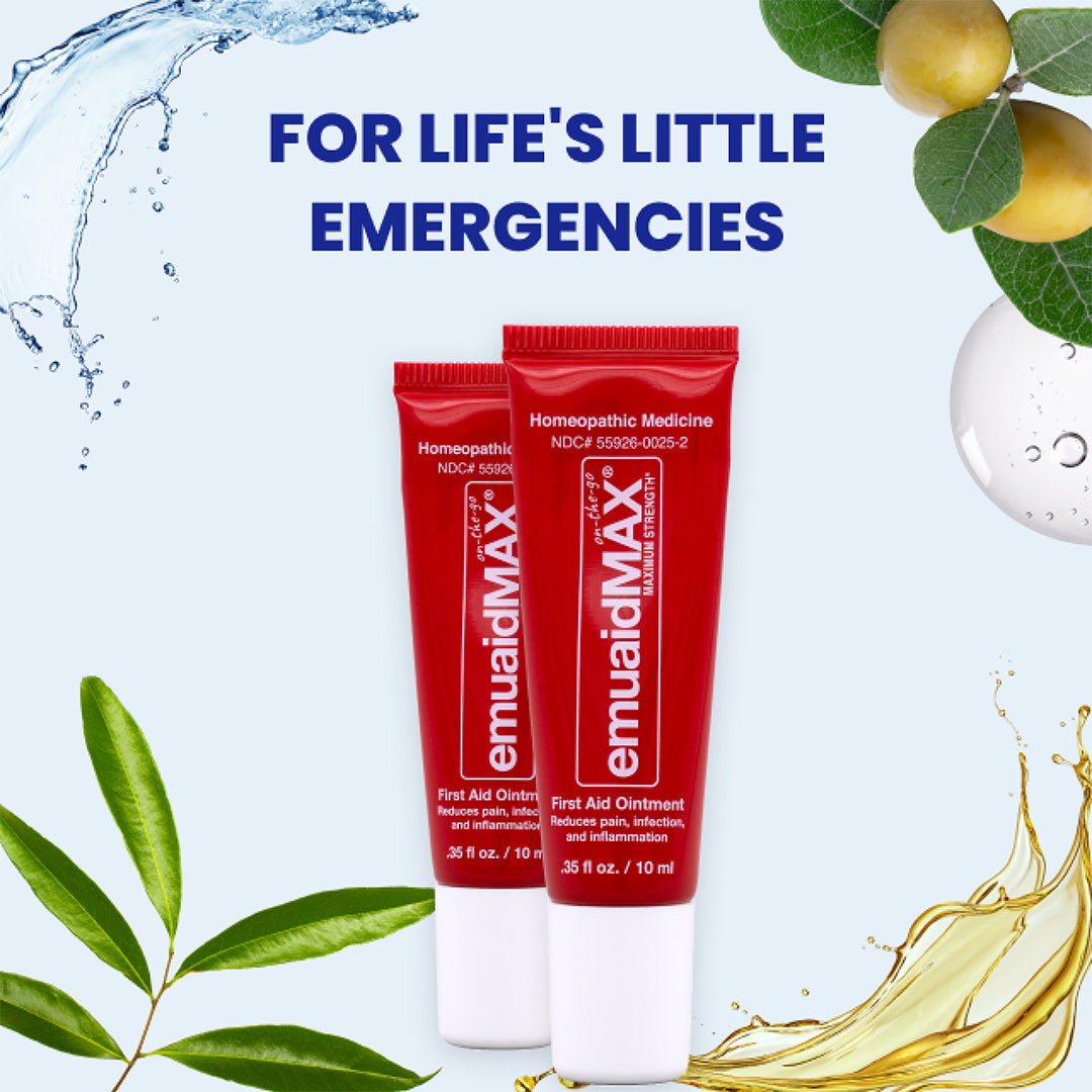 two tubes of emu aid max ointment on abstract background