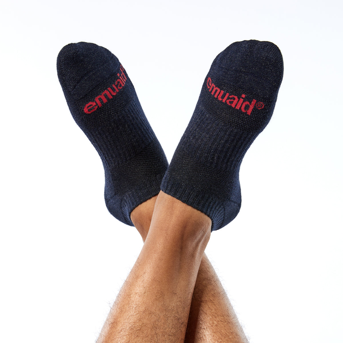 black socks with red logo crossed legs
